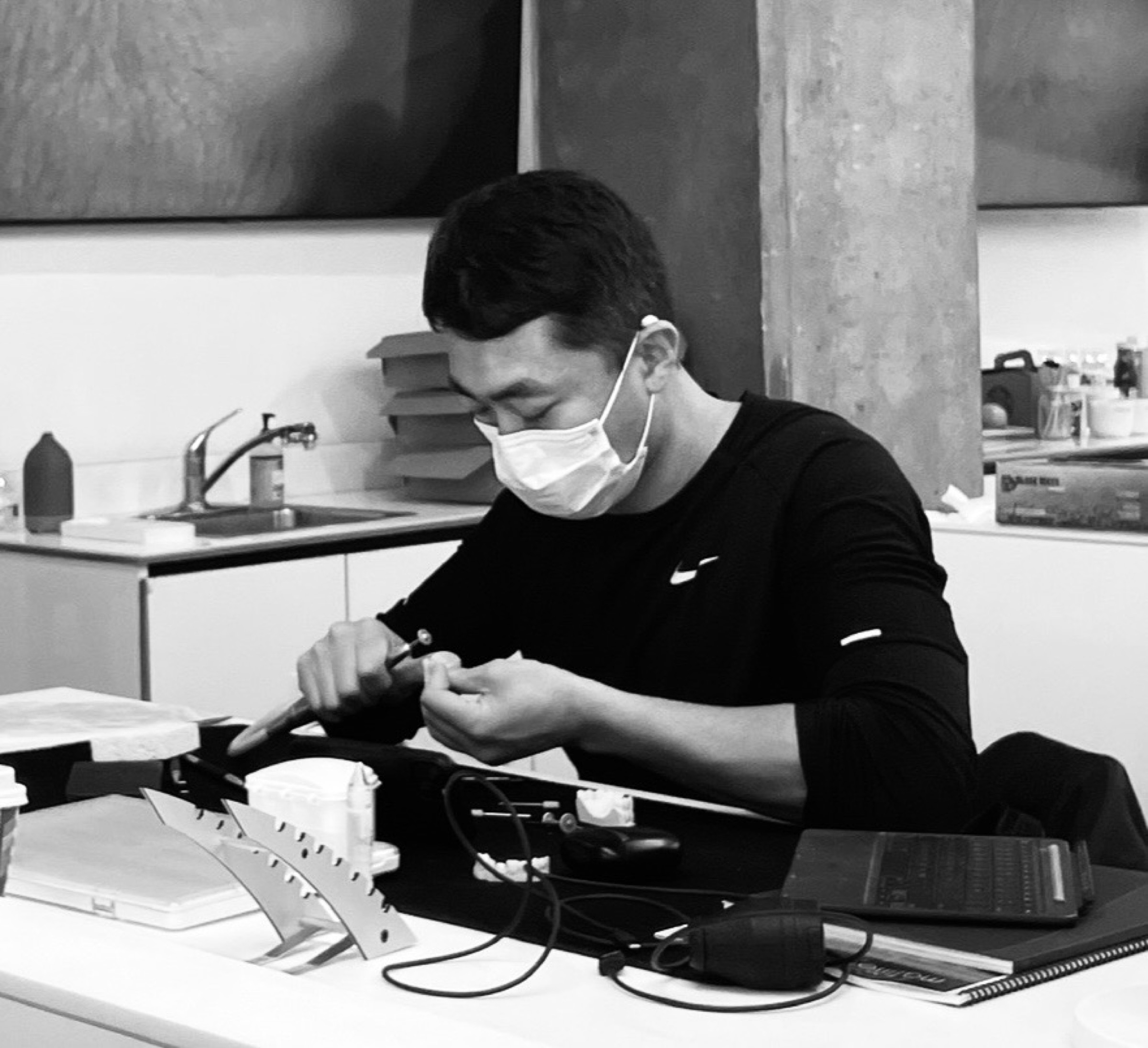 Joshua Cho working on a dental restoration at the laboratory bench